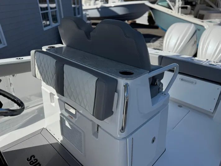  Yacht Photos Pics 2025 Everglades 285 Center Console boat interior with cushioned seating and cup holder.