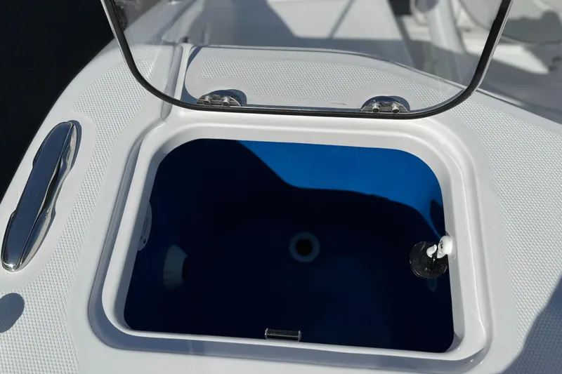  Yacht Photos Pics Livewell on 2025 Everglades 285 Center Console boat, open lid, white and blue interior.