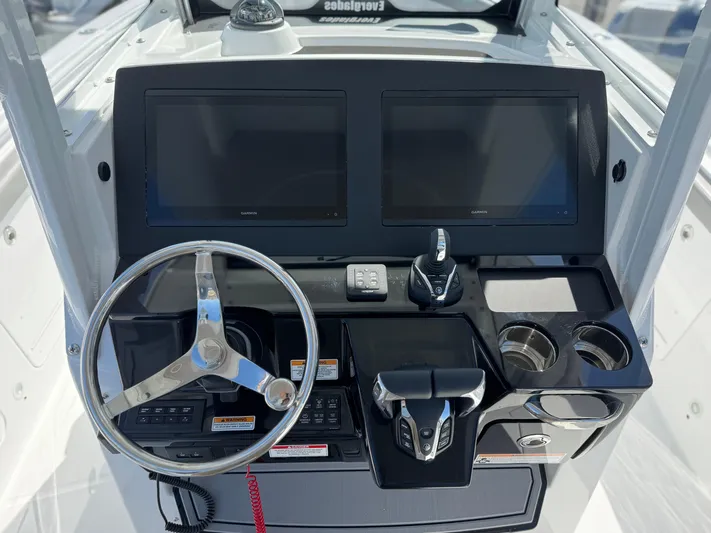  Yacht Photos Pics 2025 Everglades 285 Center Console helm with dual screens and modern controls.