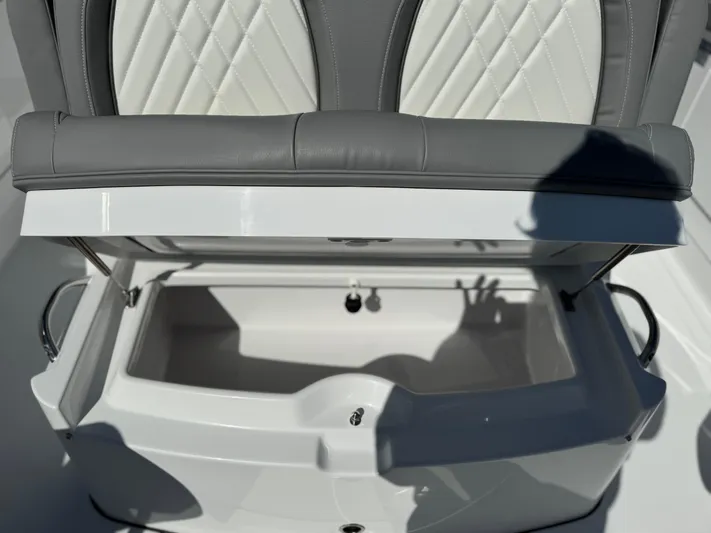  Yacht Photos Pics 2025 Everglades 285 Center Console seat with open storage compartment.