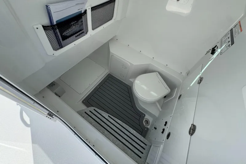  Yacht Photos Pics Interior of 2025 Everglades 285 Center Console boat with compact marine toilet.