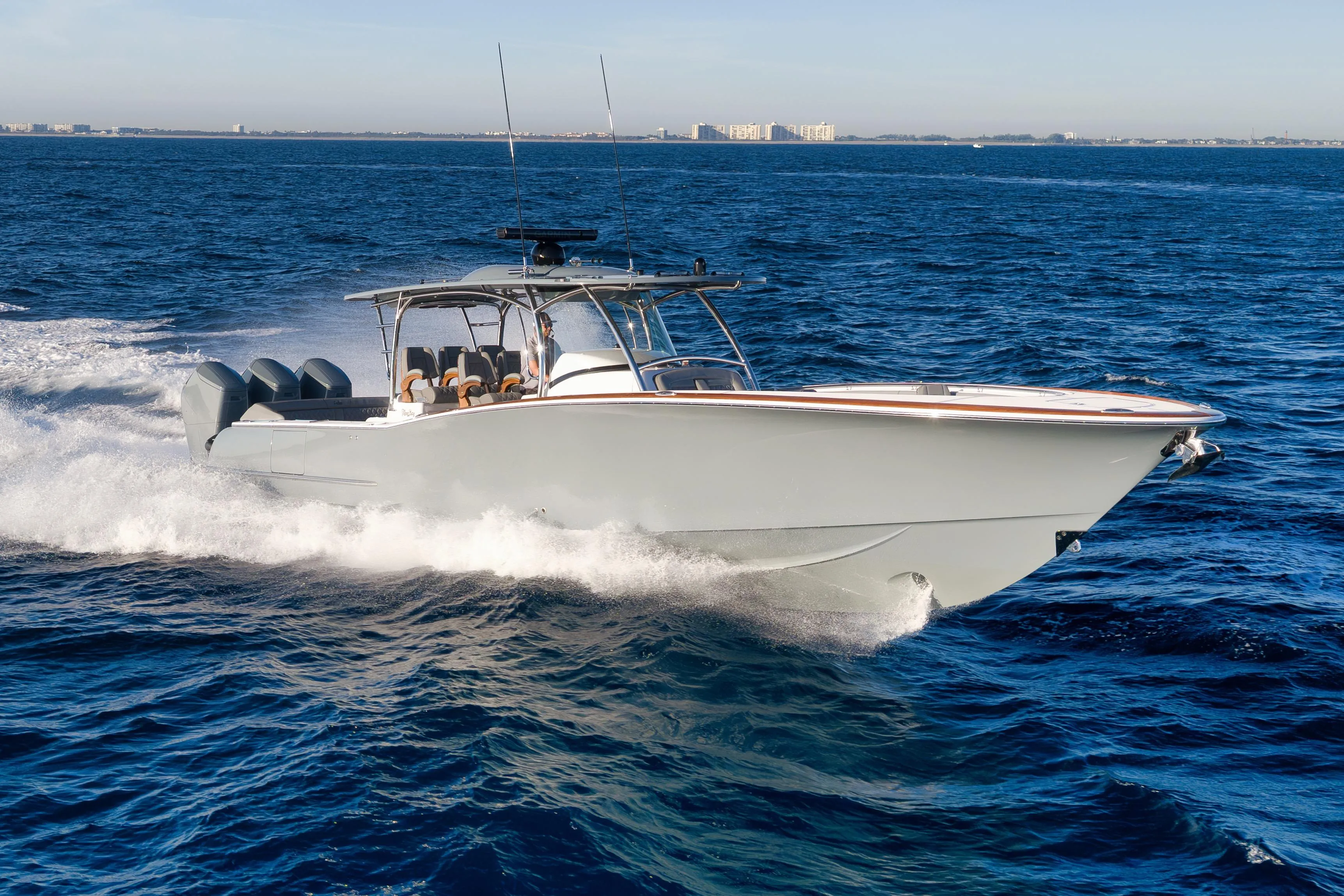 2026 Mag Bay 43 CC cruising on open ocean, showcasing sleek design and powerful performance.