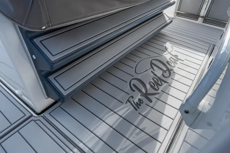  Yacht Photos Pics 2023 Tidewater 380 CC Adventure boat deck with custom "The Reel Deal" design.