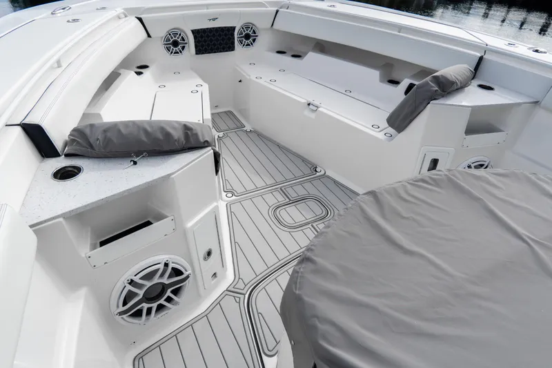  Yacht Photos Pics 2023 Tidewater 380 CC Adventure boat interior with cushioned seating and modern design.