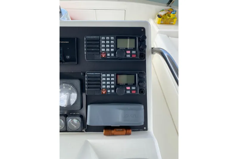  Yacht Photos Pics Control panel of 1995 Hatteras 50 Convertible Sportfish with communication devices and gauges.
