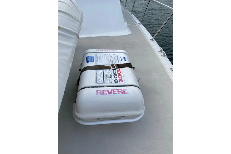  Yacht Photos Pics Life raft on 1995 Hatteras 50 Convertible Sportfish deck, secured with straps.