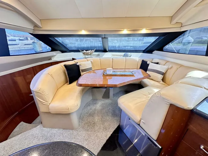  Yacht Photos Pics Luxurious 2006 Marquis Flybridge Motor Yacht interior with plush seating and elegant design.