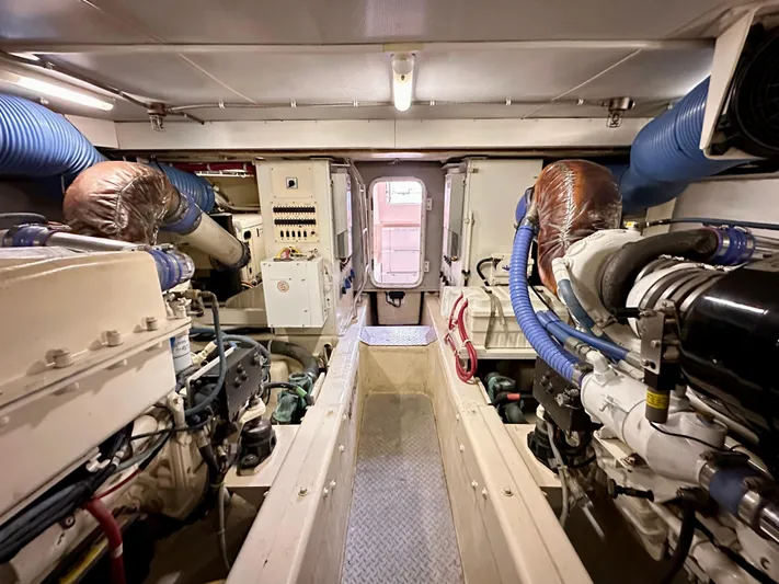  Yacht Photos Pics Engine room of a 2006 Marquis Flybridge Motor Yacht with visible machinery and equipment.