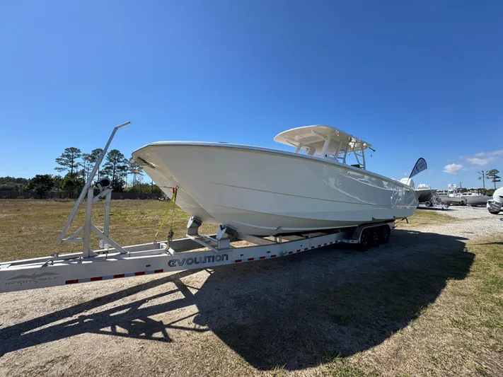  Yacht Photos Pics 2023 Invincible 37 Catamaran on trailer under clear blue sky.