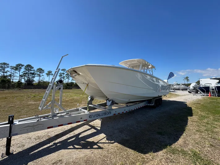  Yacht Photos Pics 2023 Invincible 37 Catamaran on trailer under clear blue sky.