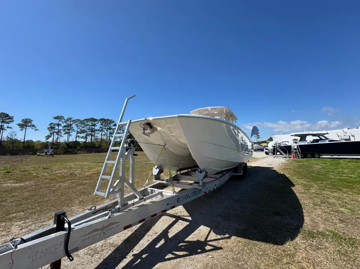  Yacht Photos Pics 2023 Invincible 37 Catamaran on trailer under clear blue sky.