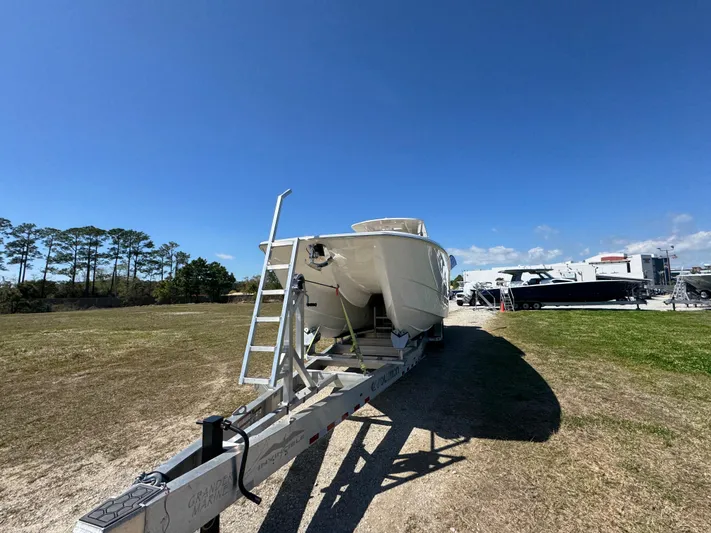  Yacht Photos Pics 2023 Invincible 37 Catamaran on trailer under clear blue sky.