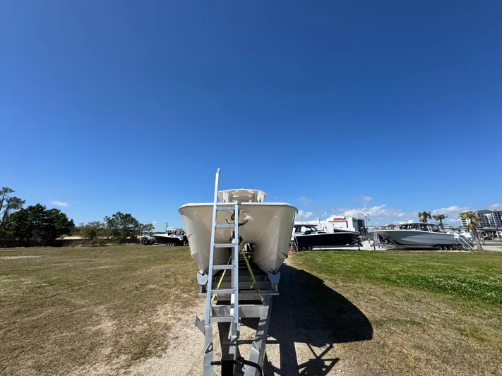  Yacht Photos Pics 2023 Invincible 37 Catamaran on trailer under clear blue sky.