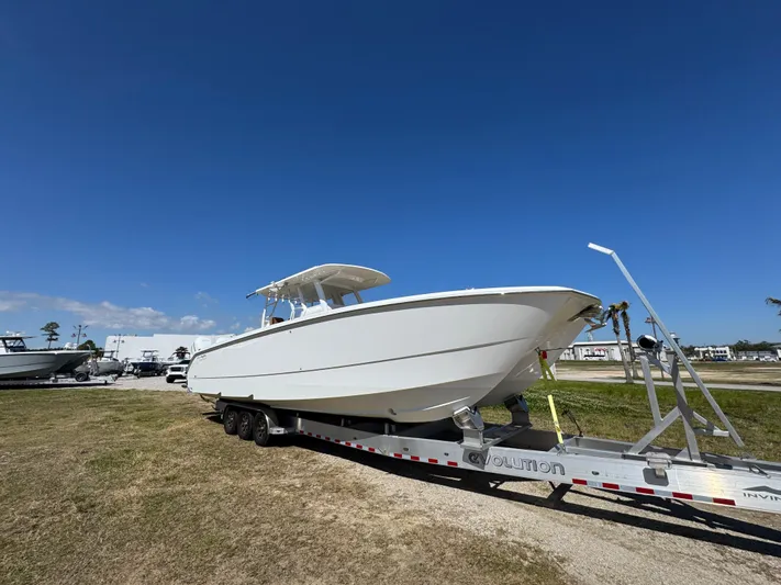  Yacht Photos Pics 2023 Invincible 37 Catamaran on trailer under clear blue sky.