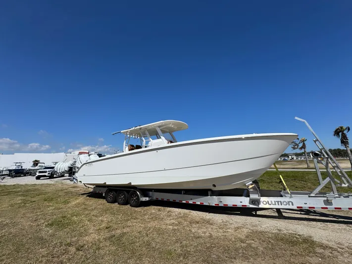  Yacht Photos Pics 2023 Invincible 37 Catamaran on trailer under clear blue sky.