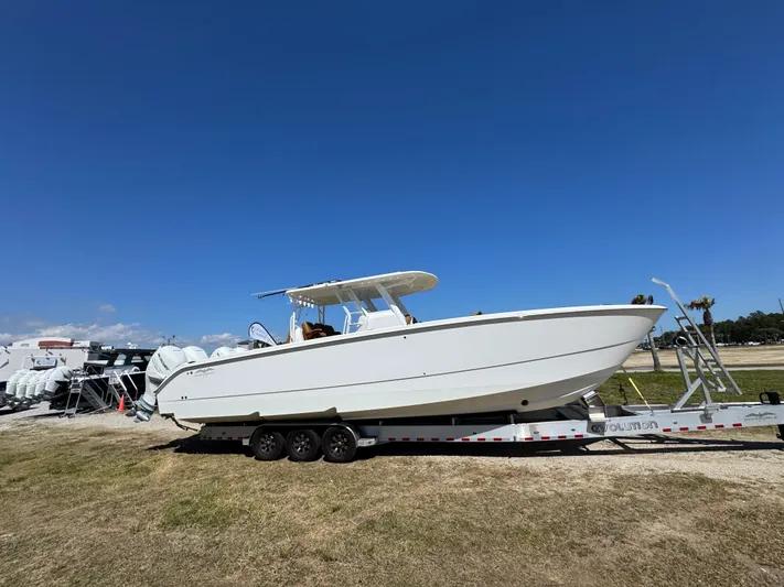  Yacht Photos Pics 2023 Invincible 37 Catamaran on trailer under clear blue sky.