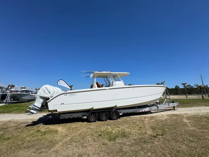  Yacht Photos Pics 2023 Invincible 37 Catamaran on trailer under clear blue sky.