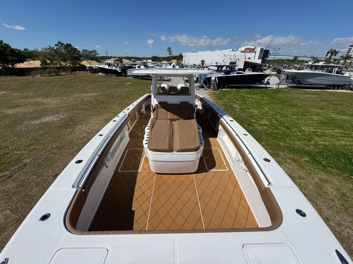  Yacht Photos Pics 2023 Invincible 37 Catamaran with spacious deck and seating, displayed outdoors.