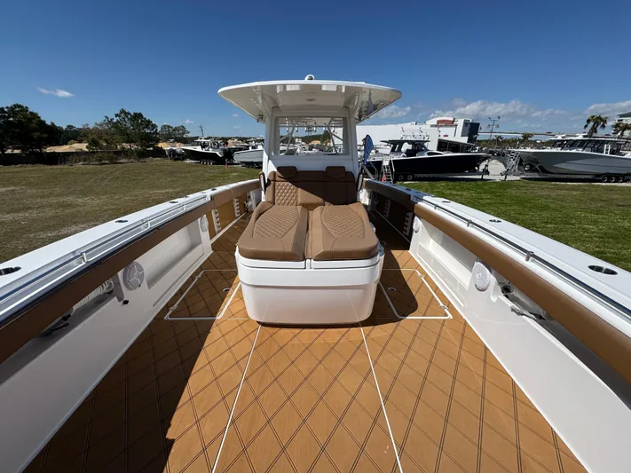  Yacht Photos Pics 2023 Invincible 37 Catamaran with spacious deck and comfortable seating under clear skies.