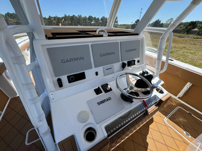  Yacht Photos Pics 2023 Invincible 37 Catamaran helm with Garmin displays and Simrad controls.