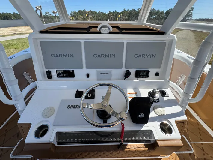  Yacht Photos Pics 2023 Invincible 37 Catamaran helm with Garmin displays and Simrad controls.
