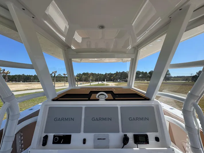  Yacht Photos Pics 2023 Invincible 37 Catamaran helm with Garmin displays and Mercury controls.