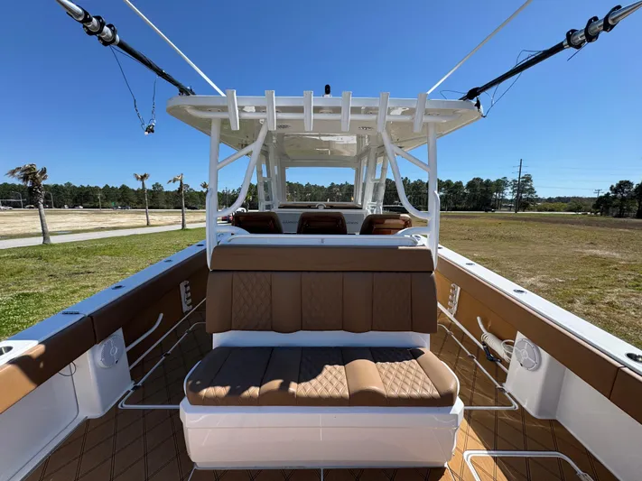  Yacht Photos Pics 2023 Invincible 37 Catamaran with tan seating, spacious deck, and modern design.