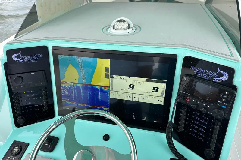  Yacht Photos Pics Dashboard of 2026 Stanley White Fishmaster boat with navigation and communication systems.