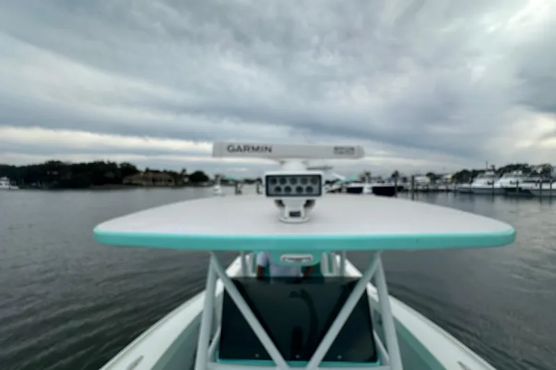  Yacht Photos Pics 2026 Stanley White Fishmaster boat with Garmin radar on calm waters under cloudy skies.