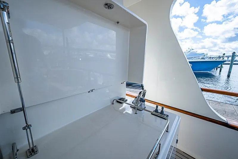 Ben's Barge Yacht Photos Pics Outdoor sink on 2014 Marlow Explorer 66E yacht, docked with ocean view.