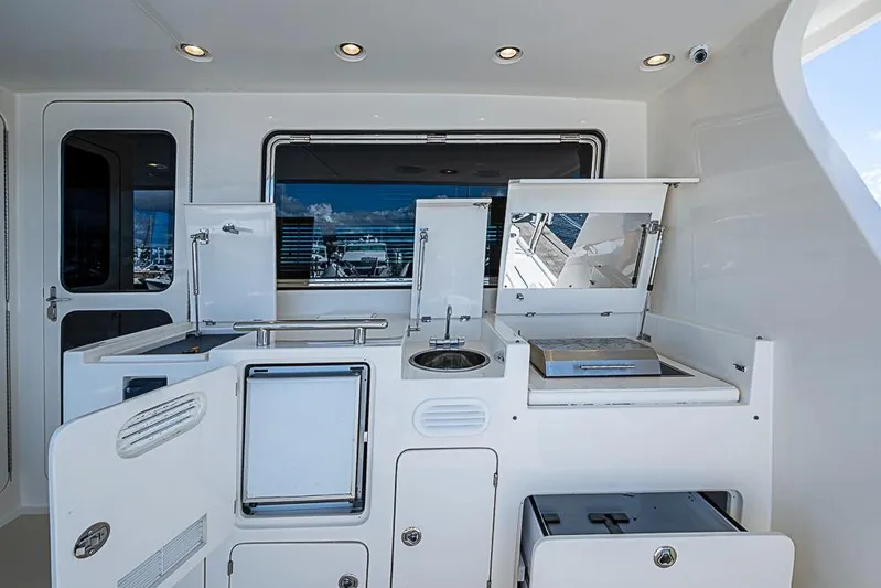 Ben's Barge Yacht Photos Pics Outdoor kitchen on 2014 Marlow Explorer 66E yacht with grill and sink.