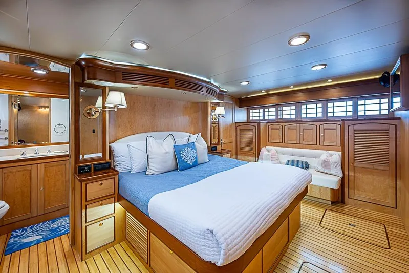 Ben's Barge Yacht Photos Pics Luxurious cabin interior of 2014 Marlow Explorer 66E yacht with elegant wood finishes.