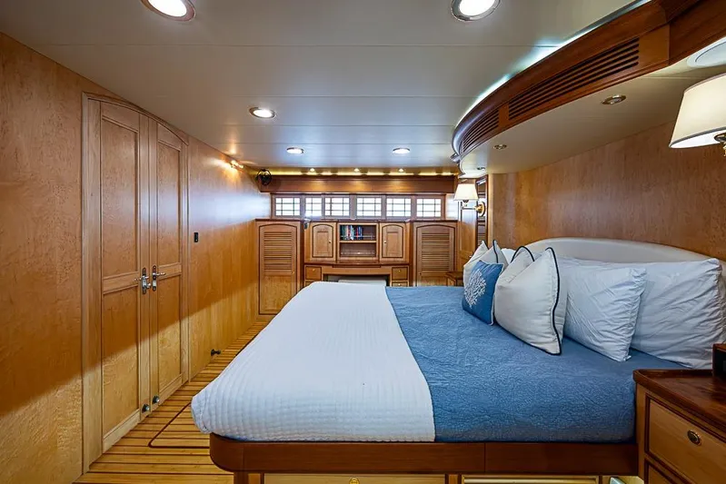 Ben's Barge Yacht Photos Pics Luxurious cabin interior of 2014 Marlow Explorer 66E yacht with elegant wood finish.