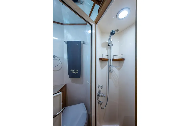 Ben's Barge Yacht Photos Pics Shower area in 2014 Marlow Explorer 66E yacht with modern fixtures.