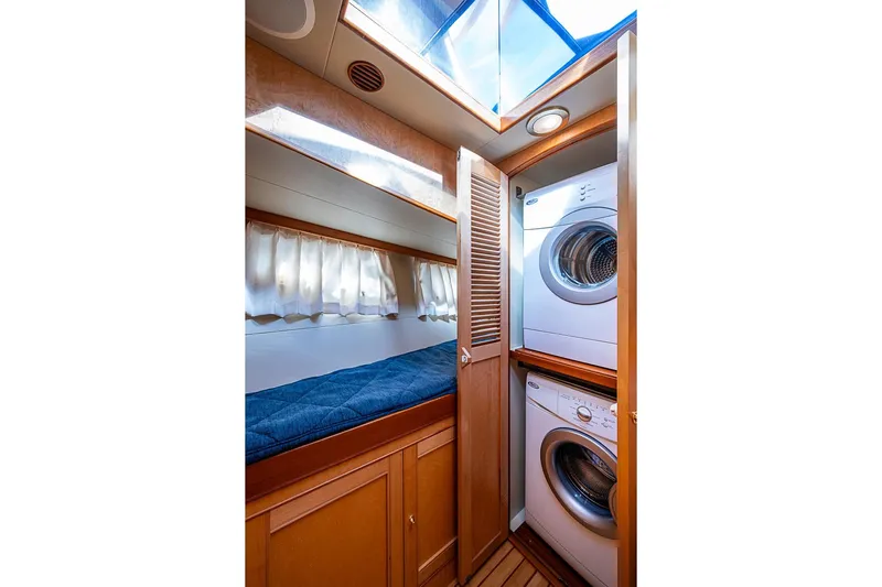 Ben's Barge Yacht Photos Pics Laundry area and cozy cabin in 2014 Marlow Explorer 66E yacht.