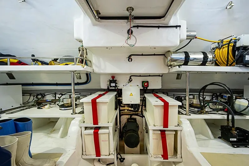 Ben's Barge Yacht Photos Pics Engine room of 2014 Marlow Explorer 66E yacht, featuring equipment and storage.