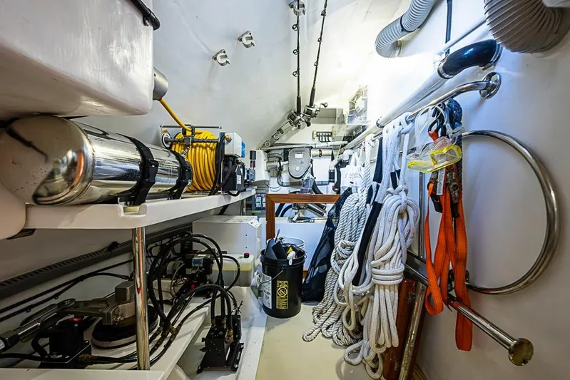 Ben's Barge Yacht Photos Pics Engine room of 2014 Marlow Explorer 66E yacht with equipment and ropes.