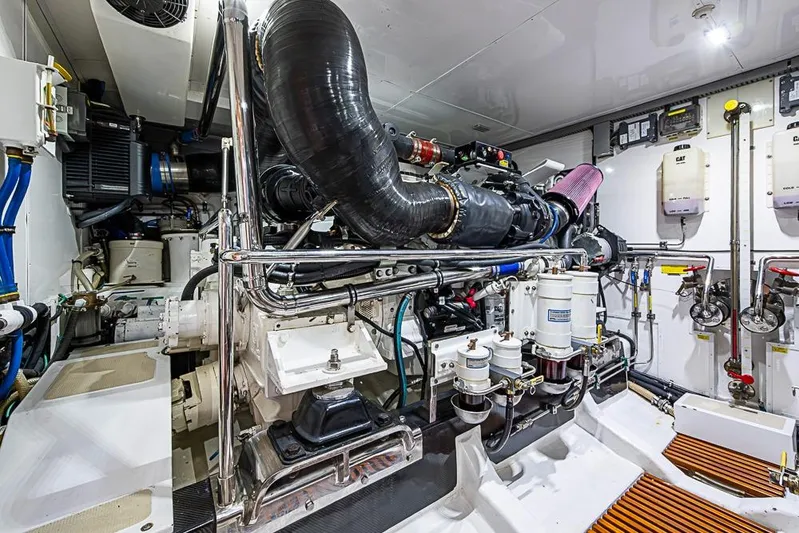 Ben's Barge Yacht Photos Pics Engine room of 2014 Marlow Explorer 66E yacht, showcasing complex machinery and systems.