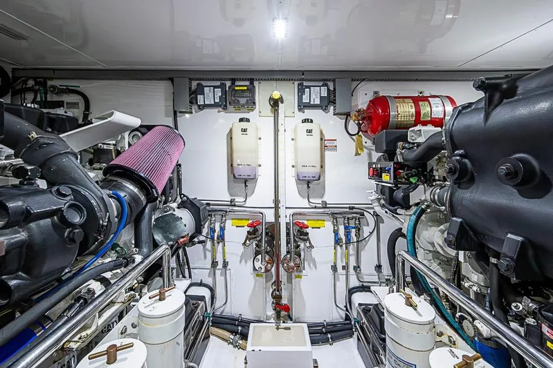 Ben's Barge Yacht Photos Pics Engine room of 2014 Marlow Explorer 66E yacht, featuring advanced mechanical systems.