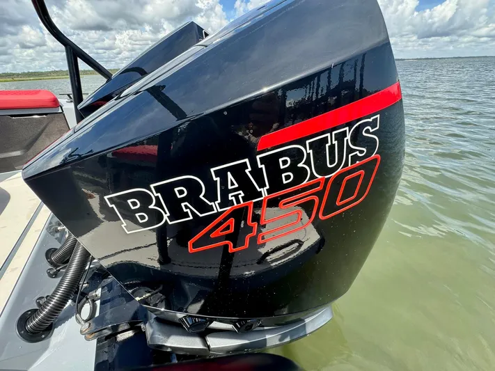  Yacht Photos Pics Outboard motor of 2023 Axopar Shadow 900XC with Brabus 450 branding on water.