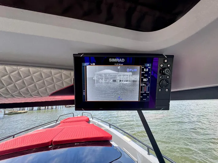  Yacht Photos Pics 2023 Axopar Shadow 900XC with Simrad display and red seating, on water.