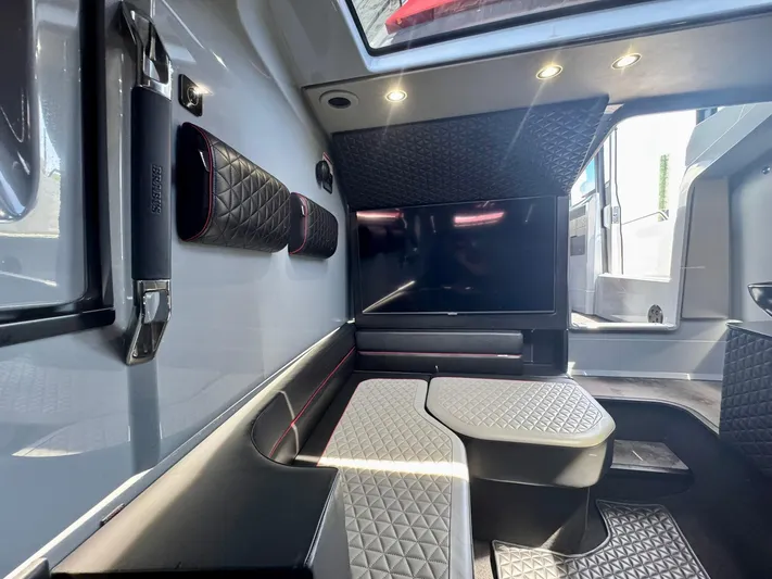  Yacht Photos Pics Luxurious interior of 2023 Axopar Shadow 900XC with quilted seating and modern design.