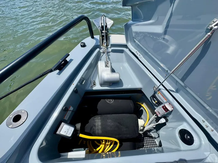  Yacht Photos Pics 2023 Axopar Shadow 900XC anchor compartment with equipment and storage.