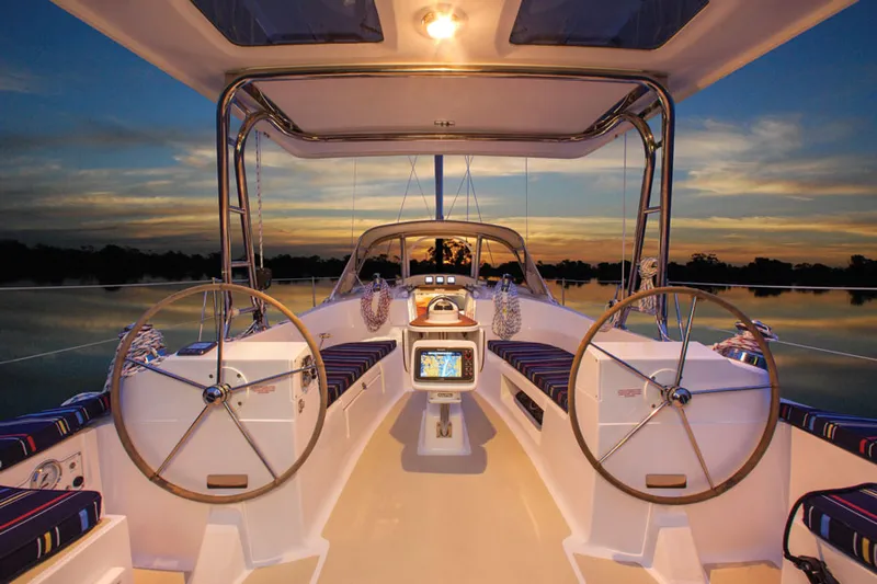 Nymph Yacht Photos Pics Interior of 2014 Marlow Hunter 40 sailboat at sunset, featuring dual steering wheels.