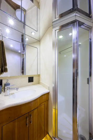  Yacht Photos Pics 2001 Hatteras 60 Enclosed Bridge yacht bathroom with shower and vanity.