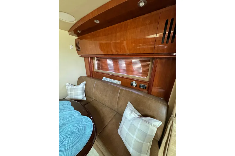  Yacht Photos Pics Luxurious interior of 2006 Sea Ray 38 Sundancer with plush seating and elegant wood finish.