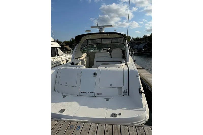  Yacht Photos Pics 2006 Sea Ray 38 Sundancer yacht docked at marina under blue sky.