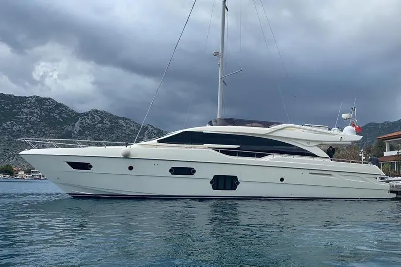  Yacht Photos Pics 2013 Ferretti Yachts 690 on water, cloudy sky, mountainous backdrop.