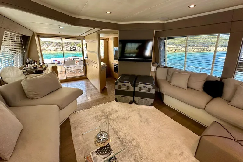  Yacht Photos Pics Luxurious interior of 2013 Ferretti Yachts 690 with plush seating and ocean view.