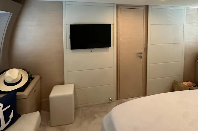  Yacht Photos Pics Luxurious interior of 2013 Ferretti Yachts 690 with modern decor and wall-mounted TV.